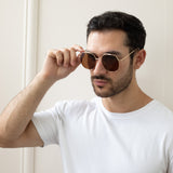Oversized rounded aviator style sunglasses with brown lenses