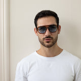 Angular Navigator style sunglasses in Brown with blue Lenses