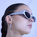 Silver racer style sunglasses with black lenses