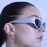 Silver racer style sunglasses with black lenses
