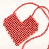 Beaded heart cross body bag in vintage pink