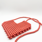 Beaded heart cross body bag in vintage pink