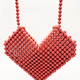 Beaded heart cross body bag in vintage pink
