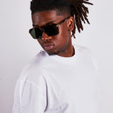 Tortoiseshell navigator sunglasses with green lenses