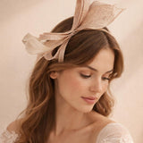 Bow Shaped Fascinator with Sinamay Curls & Feathers in Nude - svnx