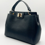 Black faux leather handbag with gold trim - svnx