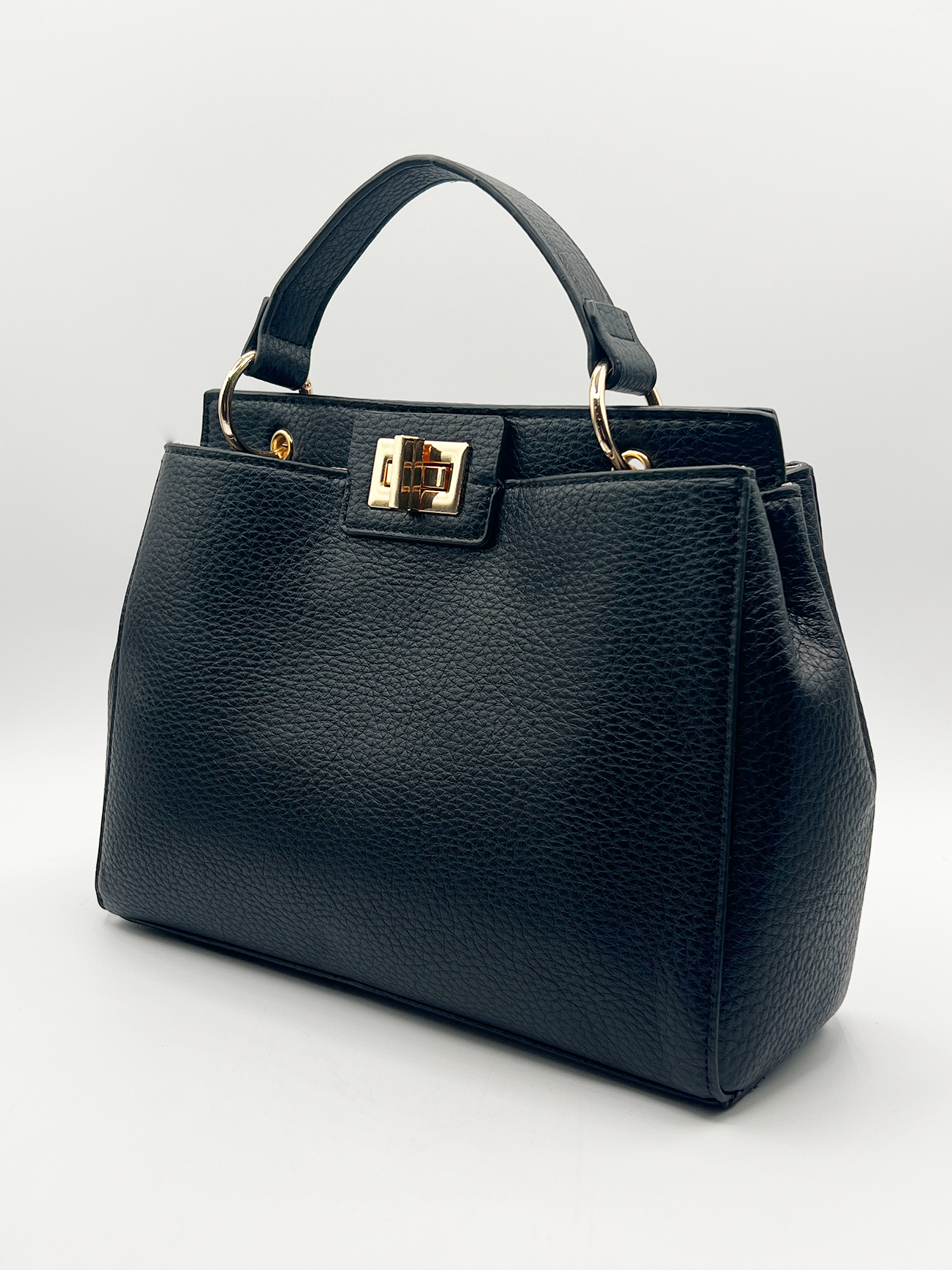Black faux leather handbag with gold trim - svnx