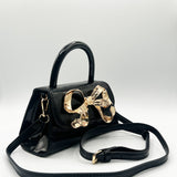 Metallic Bow Top Handle Bag in Black