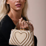 Heart Pearl Clutch Bag In Gold