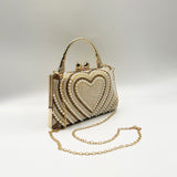 Heart Pearl Clutch Bag In Gold