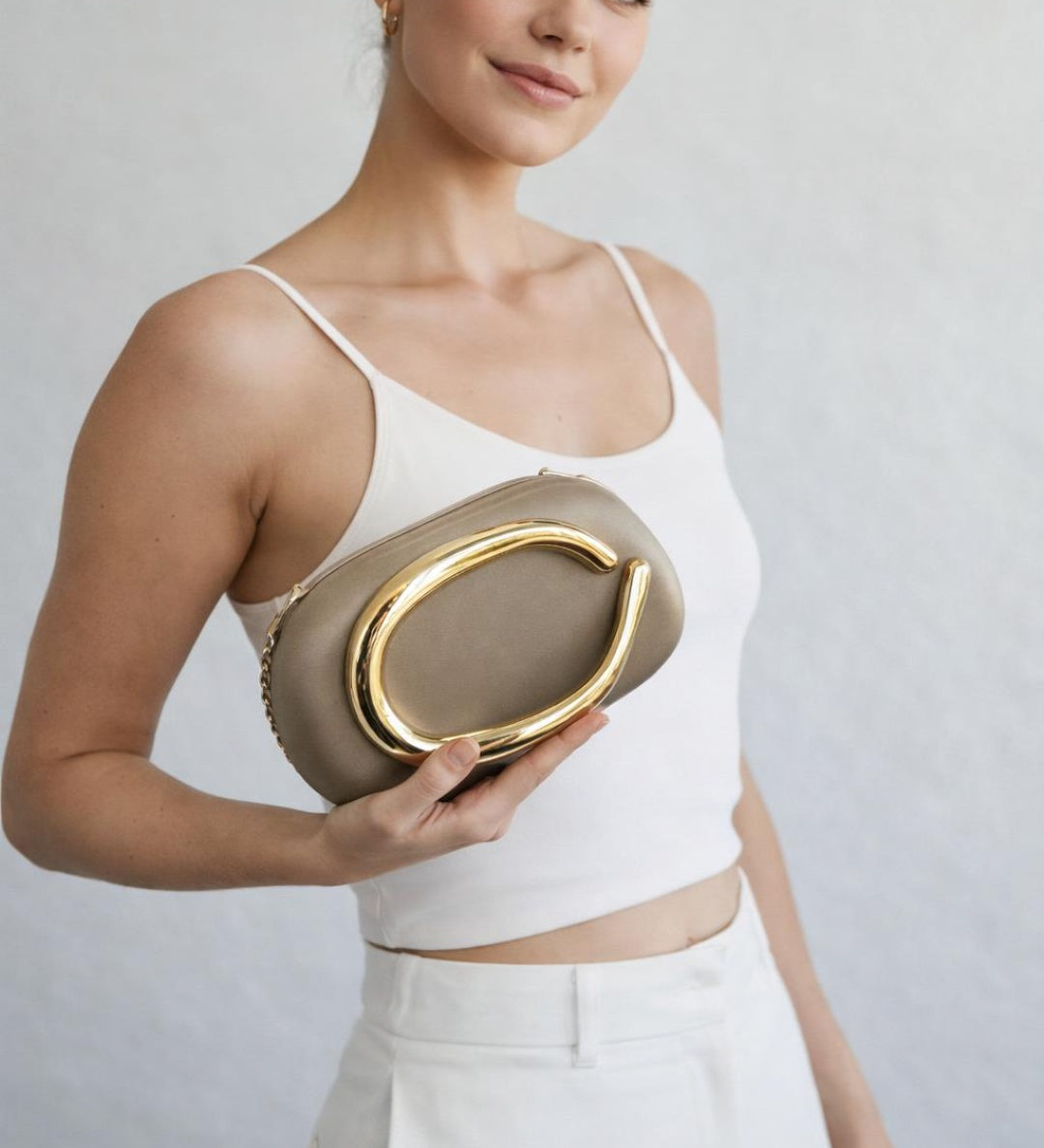 Oval Satin Hard Case Clutch Bag In Muted Gold - svnx