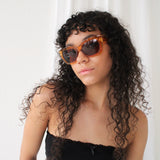 Brown cat eye angular sunglasses with brown lenses