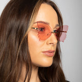 Frameless pink butterfly sunglasses