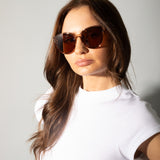 Crystal frame plastic round sunglasses with brown lenses