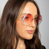 Oversized Round Frameless Sunglasses with Crystal Detail in Pink