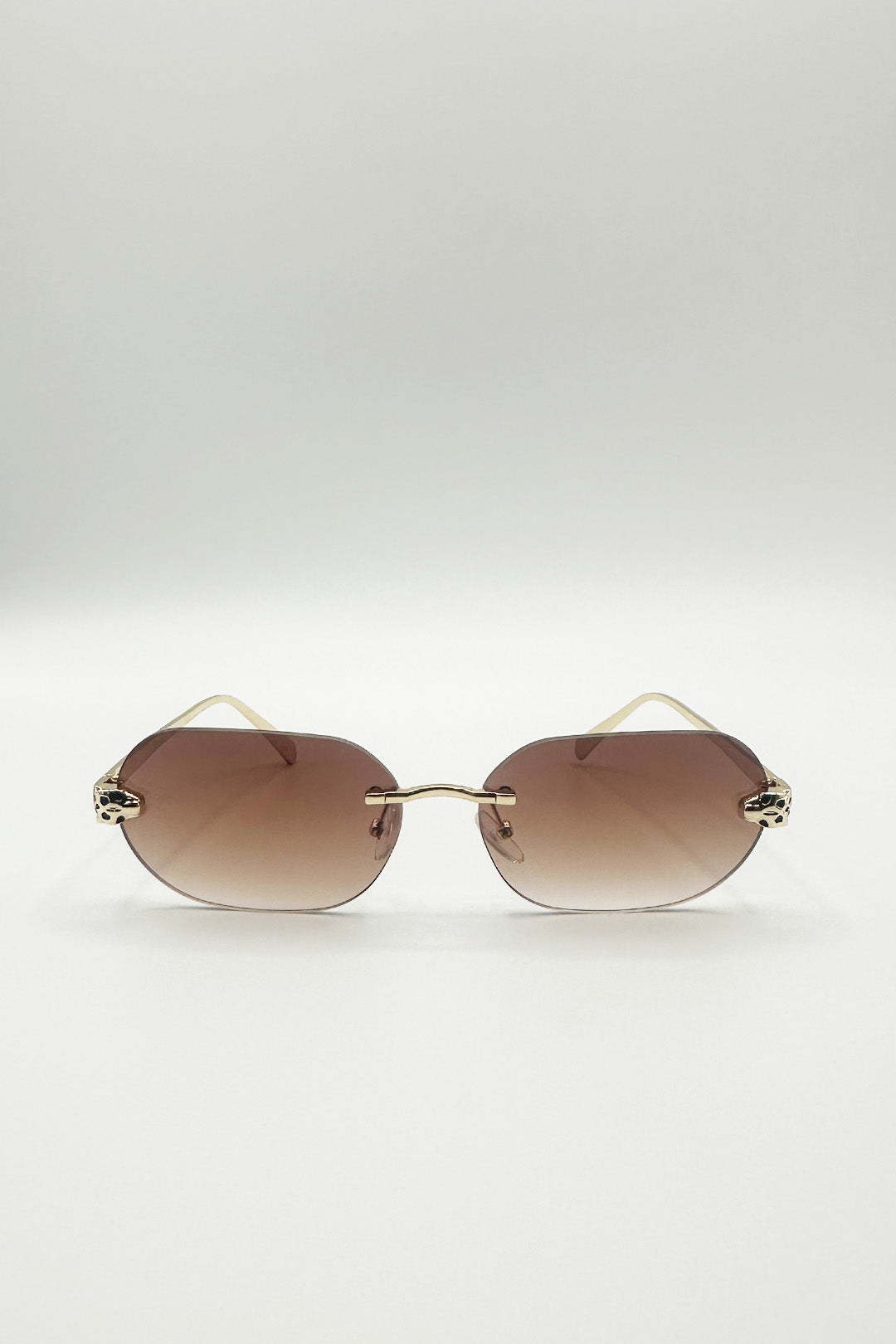 Jaguar Detail Rimless Sunglasses In Brown - svnx