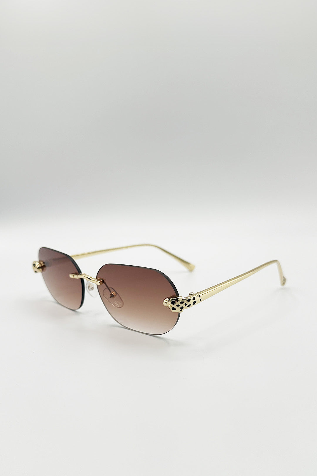 Jaguar Detail Rimless Sunglasses In Brown - svnx