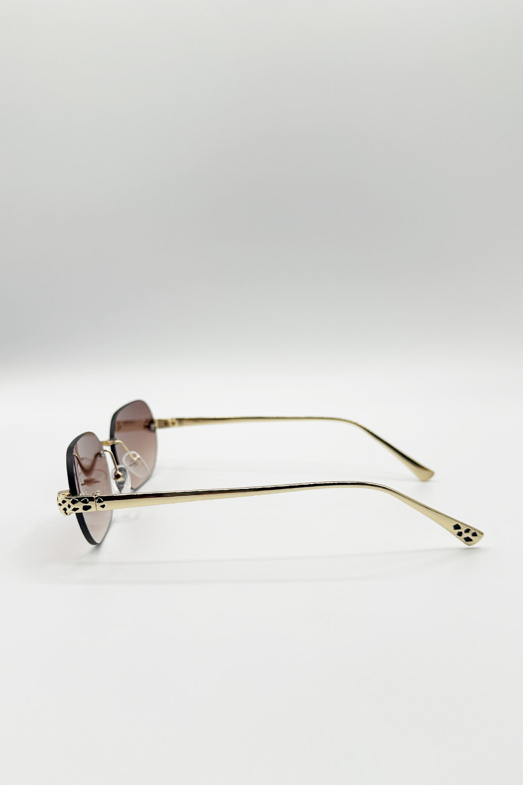 Jaguar Detail Rimless Sunglasses In Brown - svnx