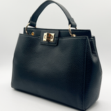 Black faux leather handbag with gold trim