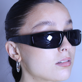 Shiny black racer style sunglasses with black lenses