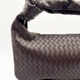 SVNX Woven PU leather grab bag with knotted strap detail in dark oak