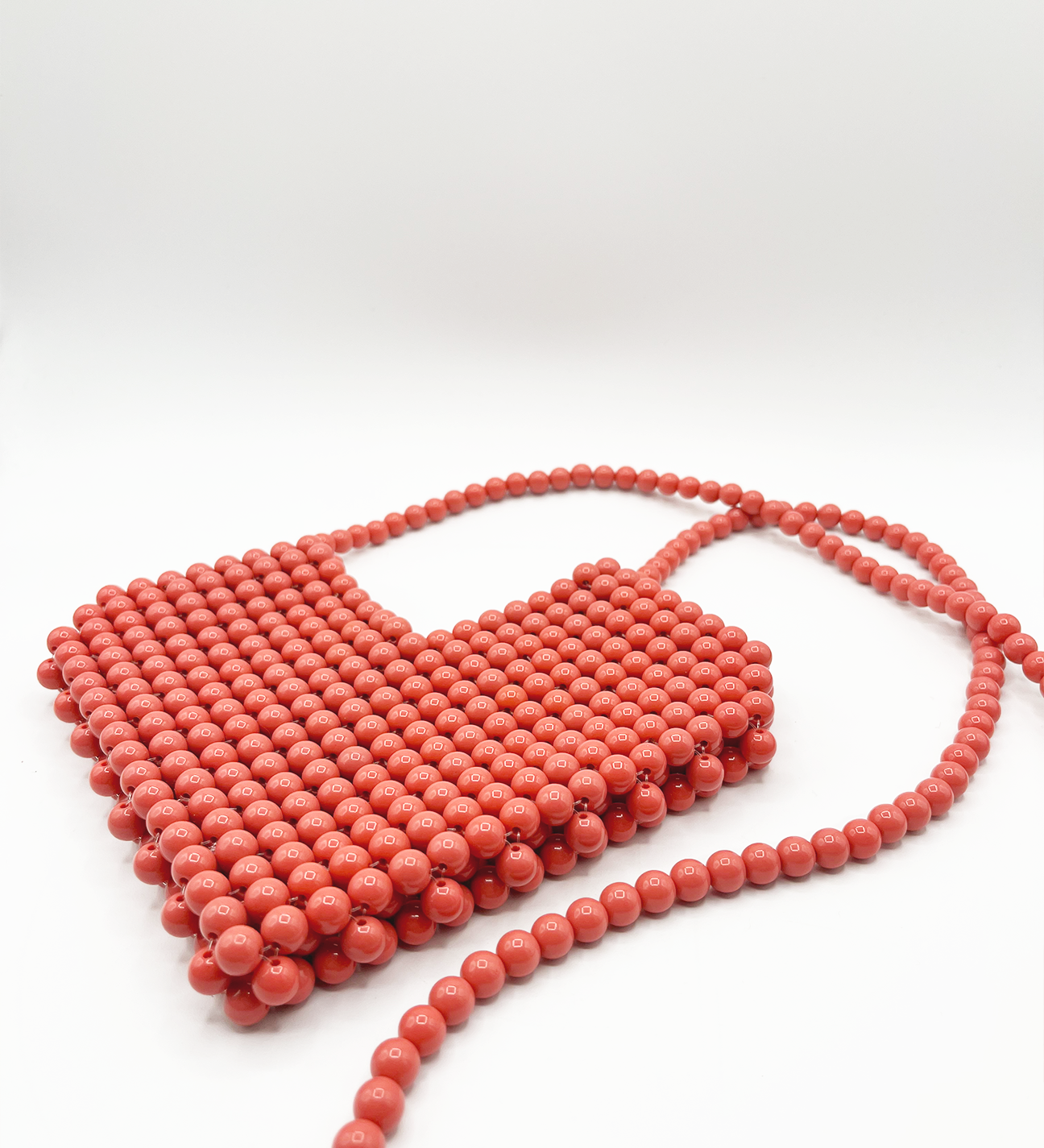 Beaded heart cross body bag in vintage pink