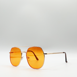 Gold rounded aviator style sunglasses with orange lenses